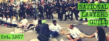 NLG legal observers talk to protesters sitting and being arrested.  