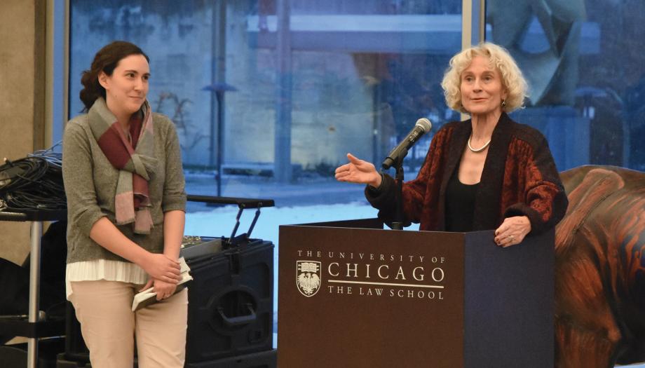 Faith Laken standing next to Martha Nussbaum at the lectern