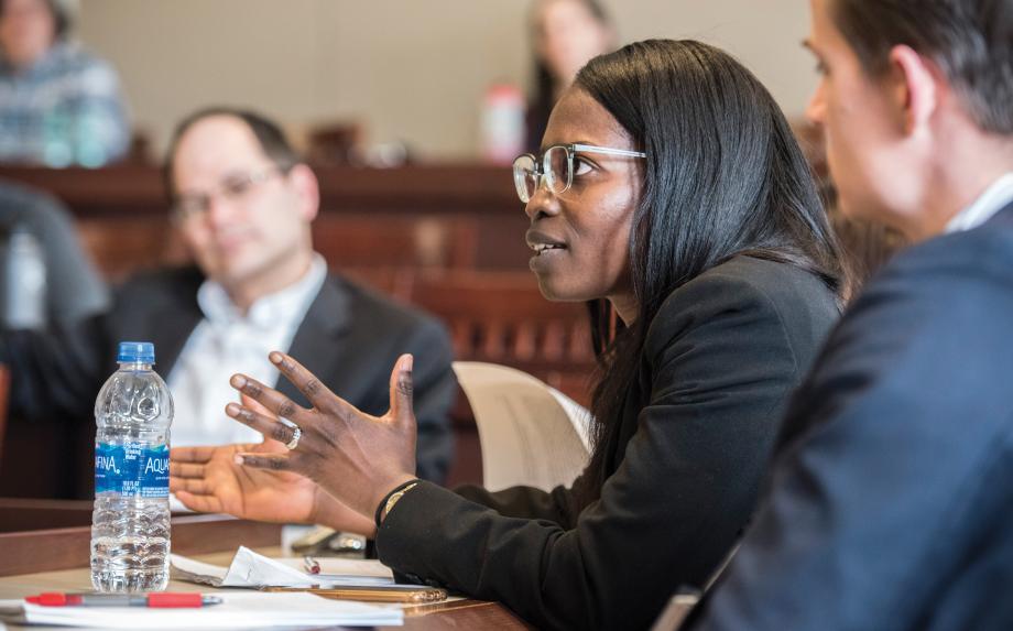 Atinuke Adediran at a table speaking