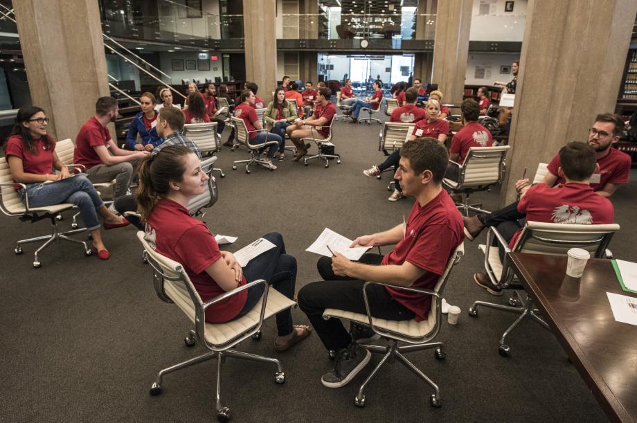 Students seated in chairs in the library