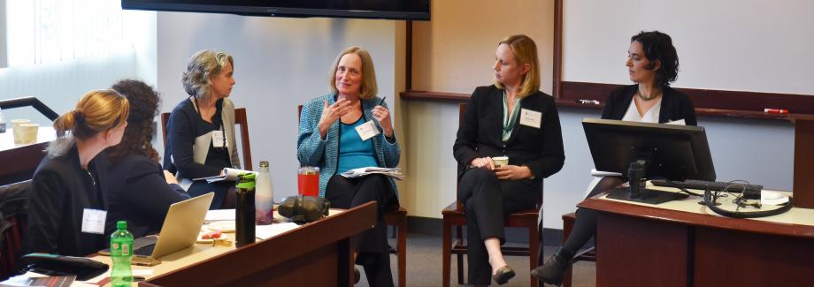 As two participants look on, scholars discuss “Regulating False Speech & Press.” From left: moderator Emily Buss of UChicago Law and panelists Jane Kirtley of the University of Minnesota Law School (speaking), Sonja West of the University of Georgia Law School, and Judith Miller of UChicago Law.