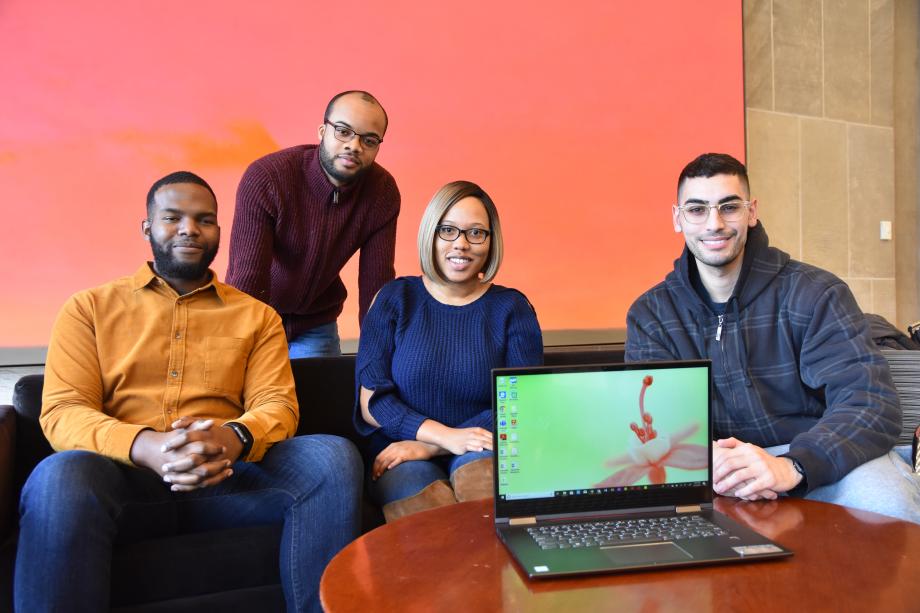 BLSA students with a Lenovo laptop in the Green Lounge