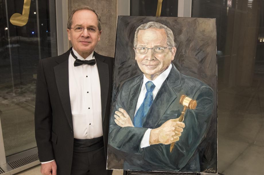 A painting of Professor Douglas Baird by Naama Shemesh, '20, was among the items sold in the silent auction.