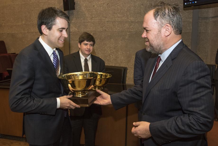 Costa (right) admires Hazel's Hinton Cup as Yarnell looks on.