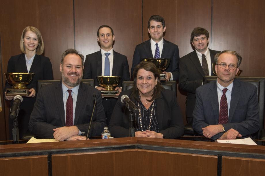 The four finalists, in two-person teams, argued New York State Rifle & Pistol Association Inc. v. City of New York before a panel of three federal judges: (front row, from left): Gregg Costa of the US Court of Appeals for the Fifth Circuit; Virginia Kendall of the US District Court for the Northern District of Illinois; and Michael Y. Scudder of the US Court of Appeals for the Seventh Circuit.
