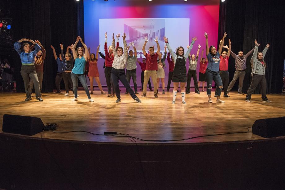 The Federalist Society and American Constitution Society student orgs join together to perform a Ke$ha medley in the classroom hallway.