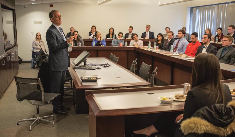 Dan Doctoroff at the front of a classroom