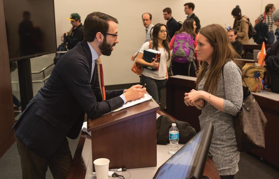 John Rappaport in conversation with a student