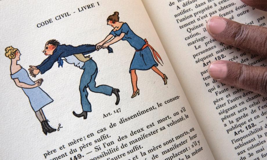 An addled man reaches for a woman while another woman holds him back