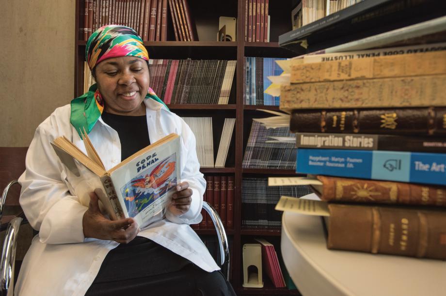 Lyonette Louis-Jacques in her office with the books