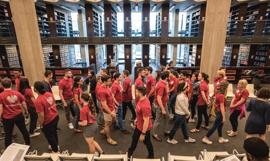 Students walking in the library