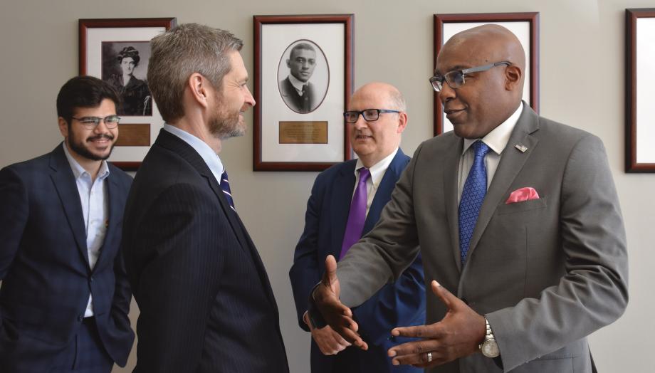 Miles, Illinois Attorney General Kwame Raoul, Adam Hassanein, and Deputy Dean Richard McAdams