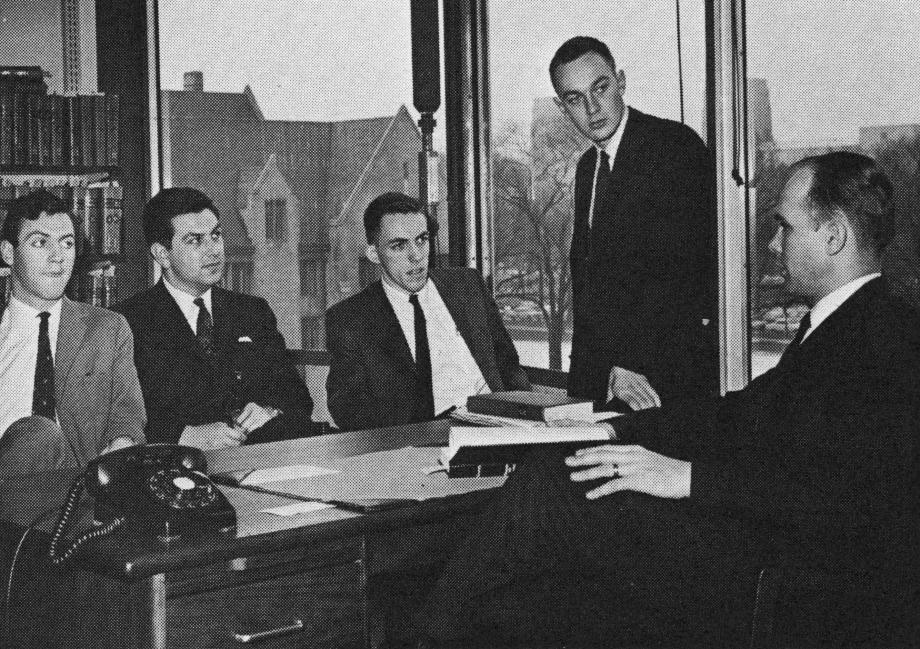 Dallin Oaks in his office with students