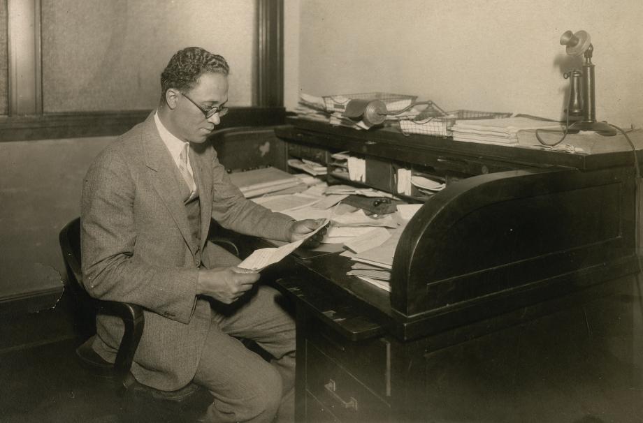 Dickerson seated at a desk