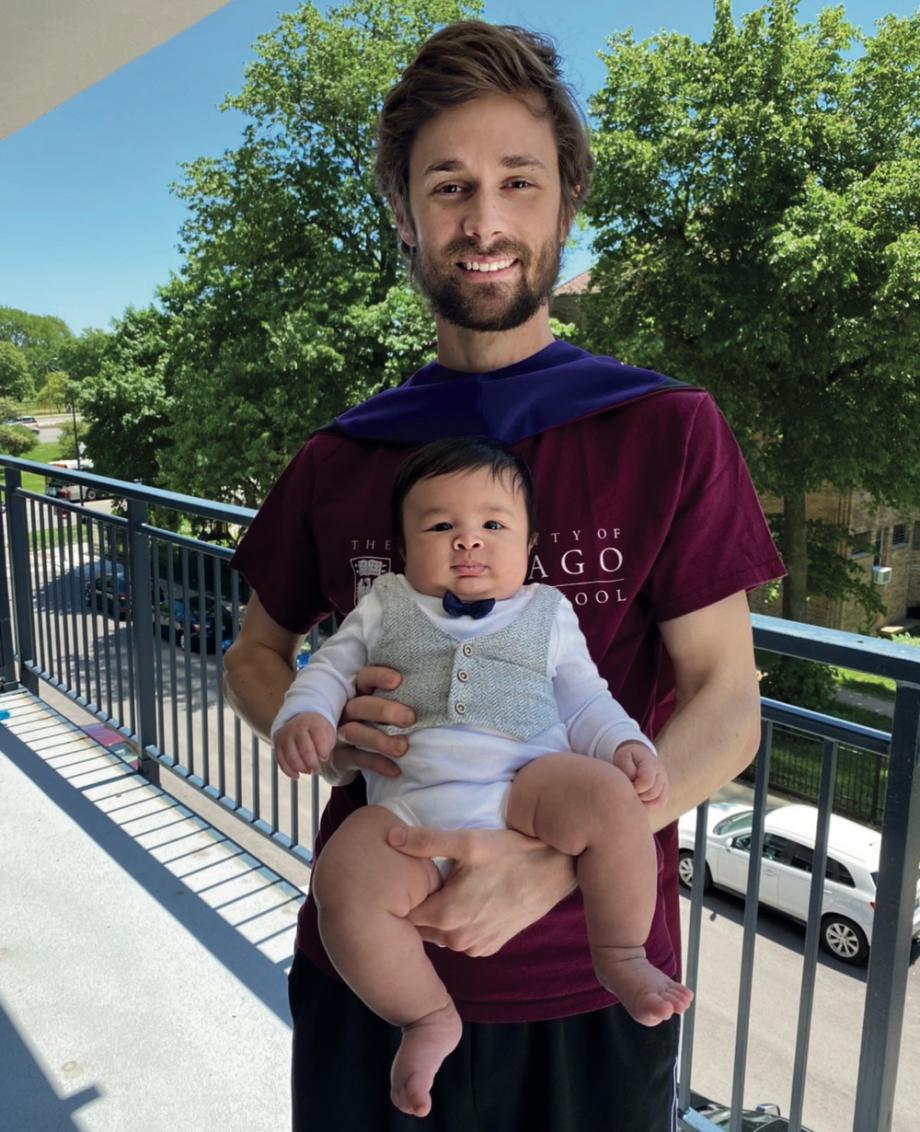 Student Charlie Capps holding his baby