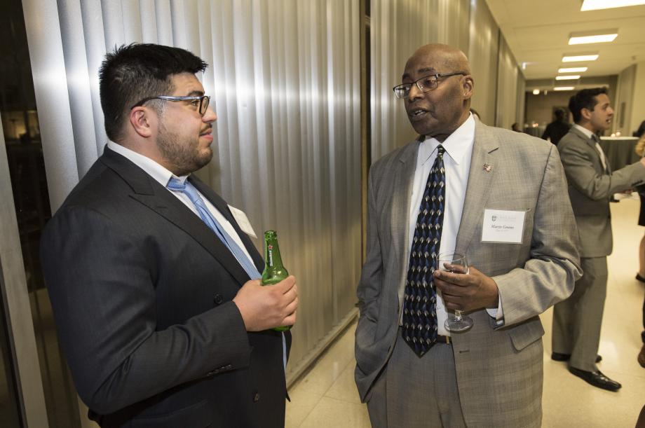 Chris Verdugo, '20, talked with Martin Green, '77, during the cocktail reception before dinner.