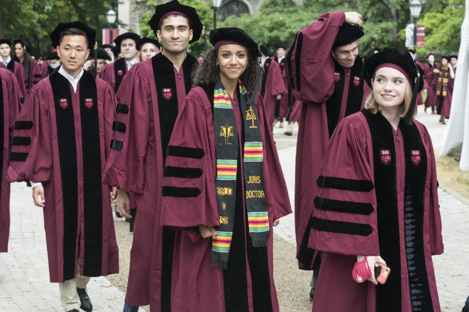 Students in caps and gowns line up for the procession