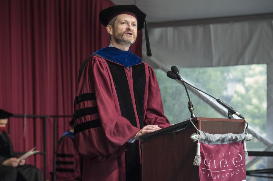 Dean Miles speaking at the podium.