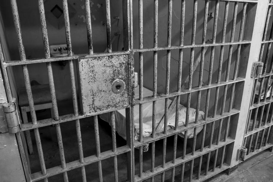 black and white stock image of prison bars