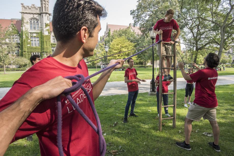 Students collaborate on a ropes course during a Kapnick program