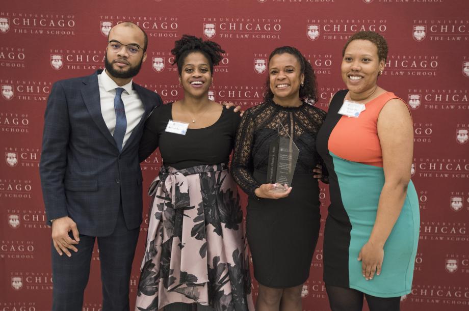 Former BLSA leaders Tyree Petty-Williams, '21, Amber Stewart, '22, and Alex Green, '22, joined Judge Ross for a photo. 