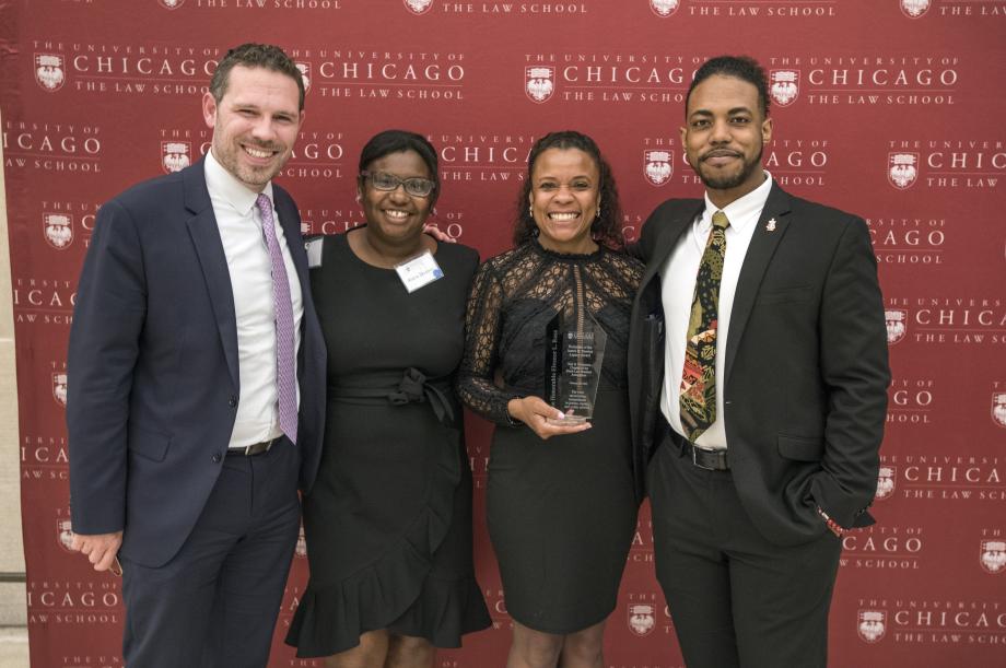 Many students, staff, and faculty were eager to take pictures with Judge Ross. Here, event organizers Avera Dorsey, '23, and Robert Johnson, '23, join Judge Ross and Dean of Students Charles Todd for a photo. 