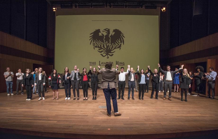 The cast on stage with Kelly Gregg giving them direction.