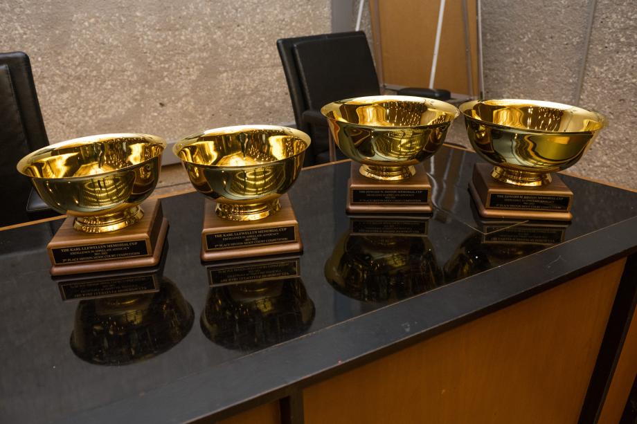 Two Hinton cups and two Llewelyn cups lined up on a countertop.