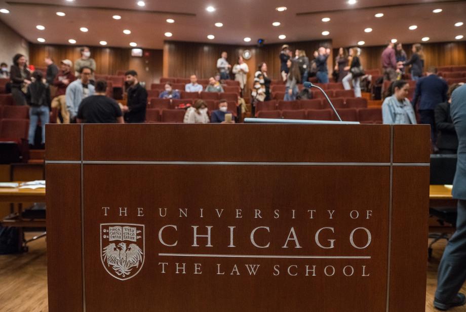 A view of the podium with people chatting in the courtroom's seat