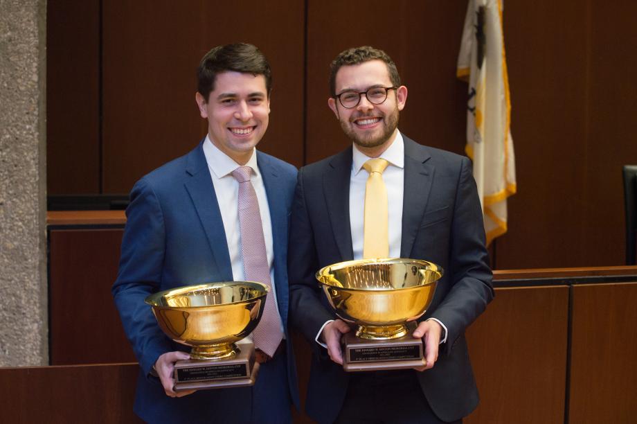 The two winners pose in the courtroom with their Hinton Cup trophies.