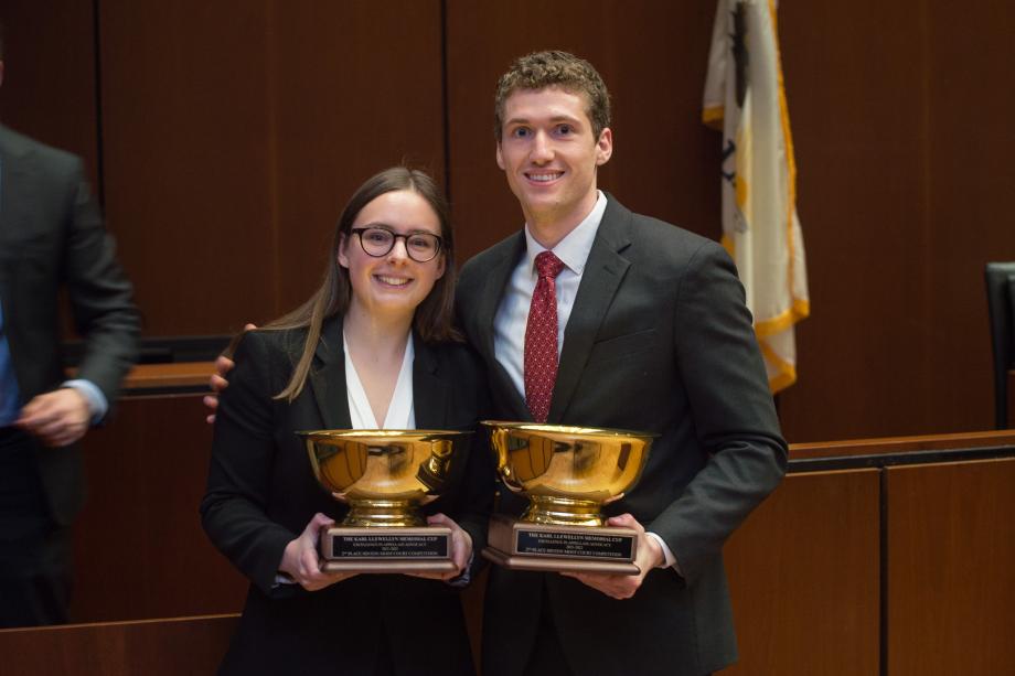 The two second-place finishers post in the courtroom with their Llewelyn Cup trophies.