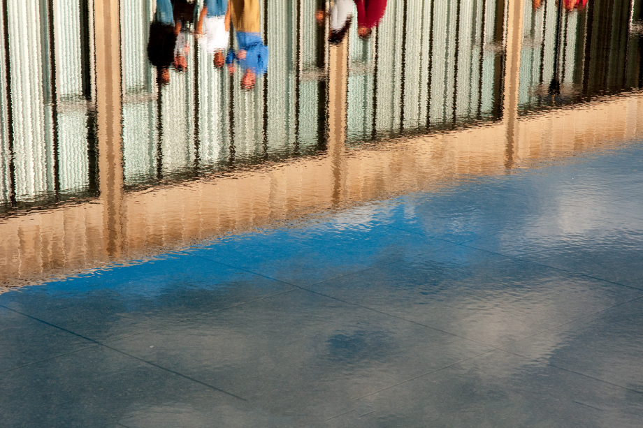 Students and exterior of classroom hallway caught in the Reflecting Pool