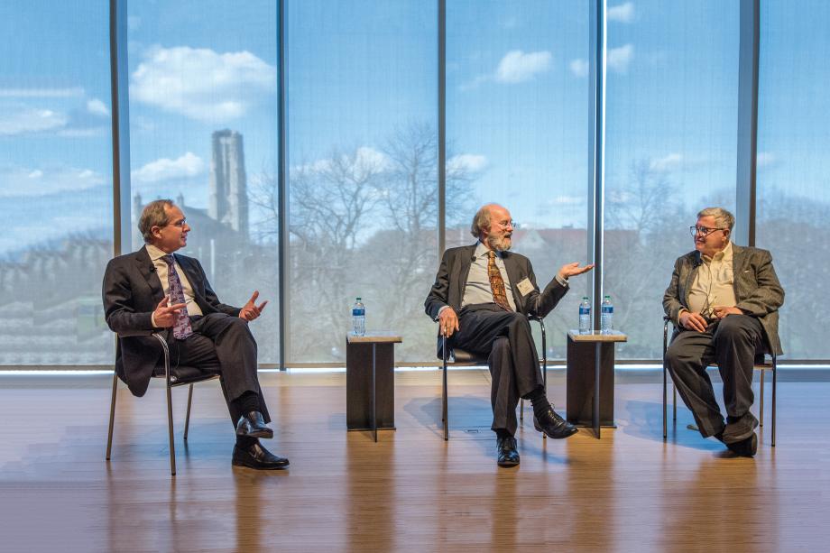 3 people sitting on chairs and talking