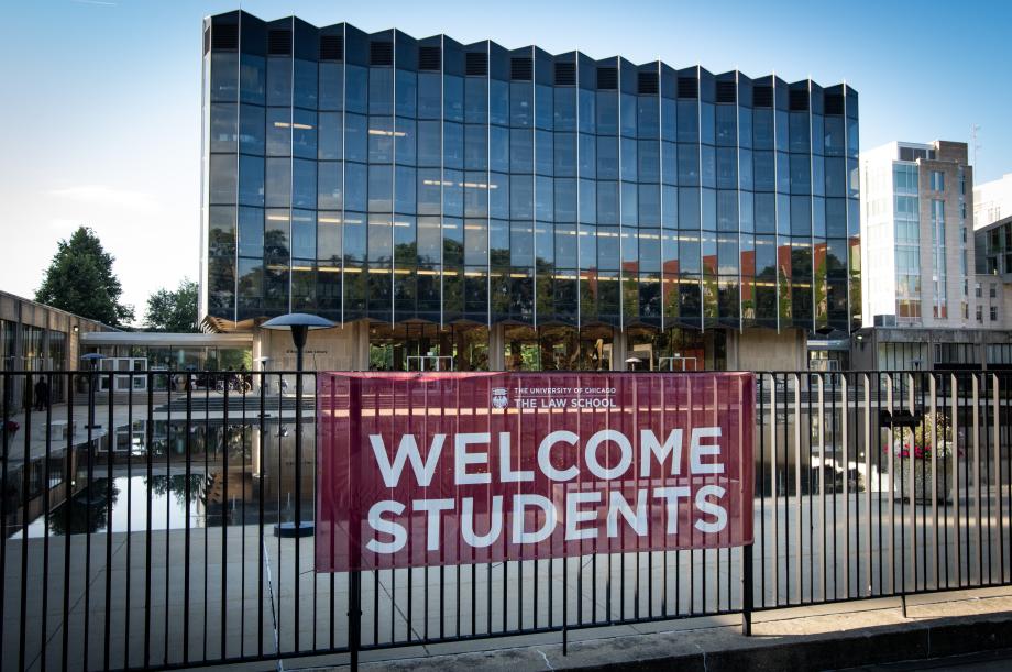 A "welcome students" banner hangs in front of the Law School building