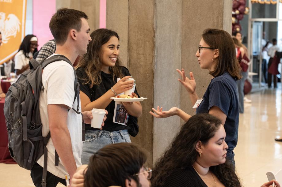 Three students speak to 