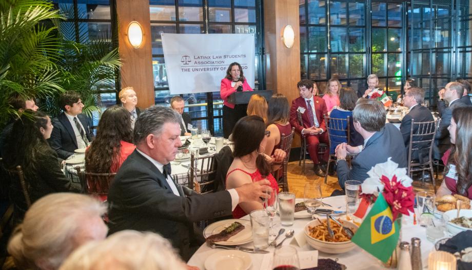 The Latinx Law Student Association honored Judge Nancy L. Maldonado of the United States District Court of the Northern District of Illinois for making a profound impact on the Latinx community. Woman standing at a lecturn addressing a room filled with people who are sitting at tables.