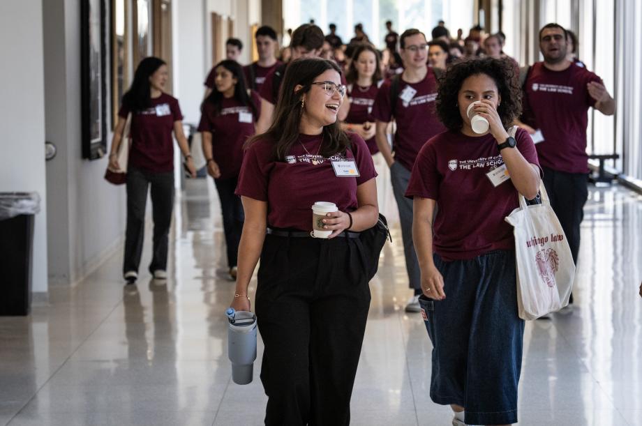 Students walking down a hallway.