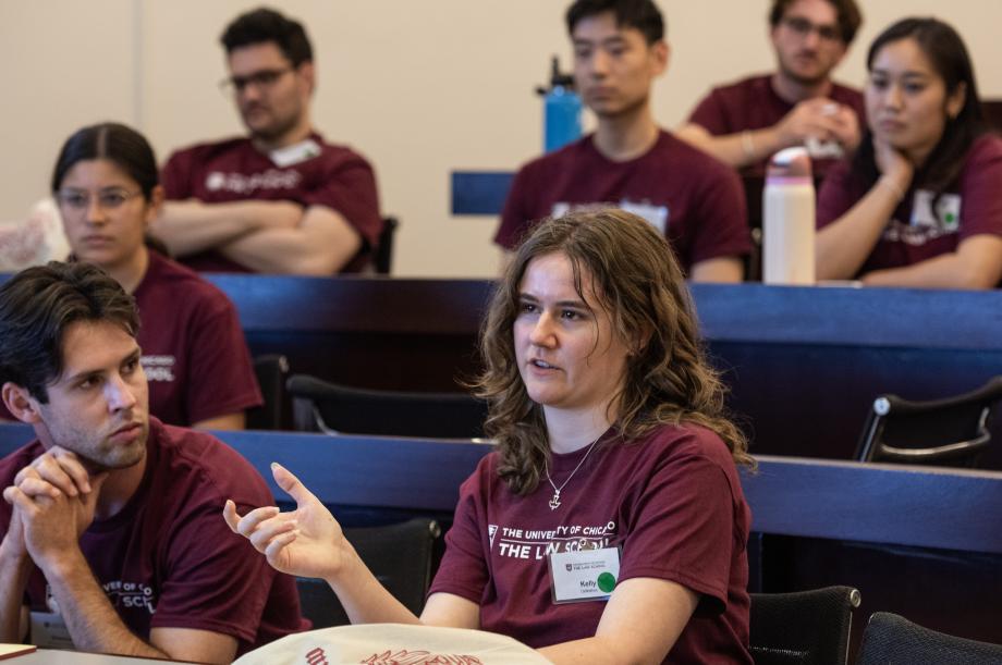 A student asks a question in a classroom.