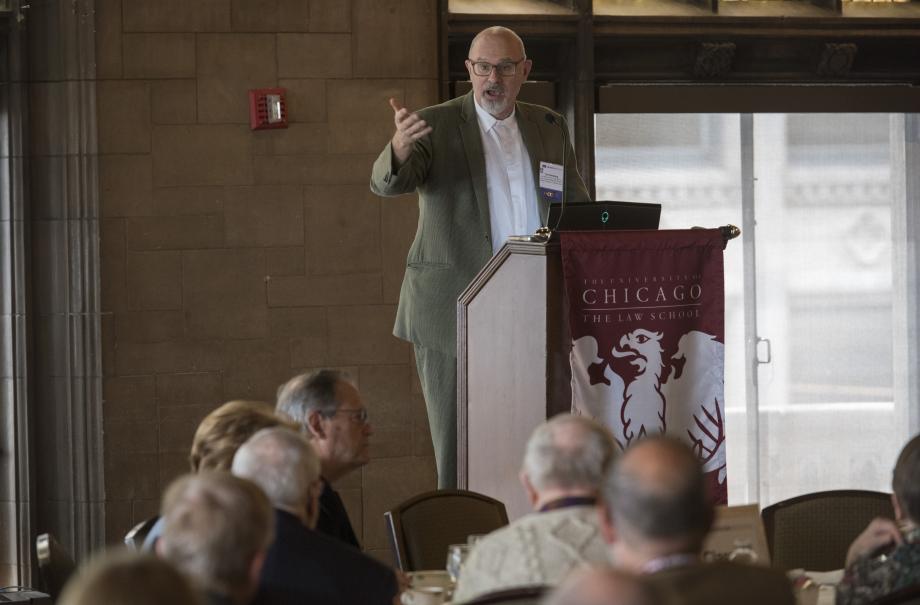 Professor Tom Ginsburg speaks from a lectern