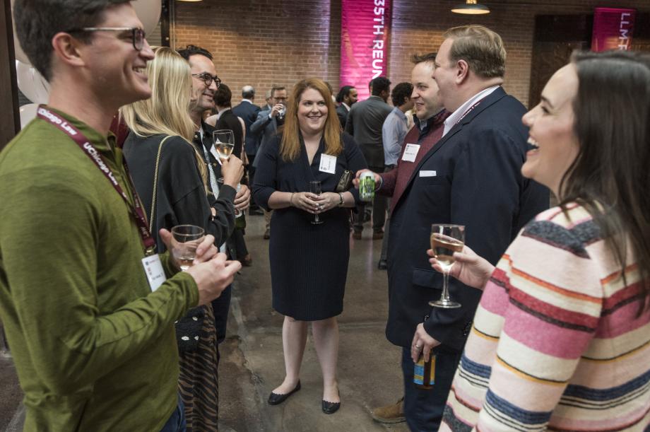 Alumni gather in small group to chat