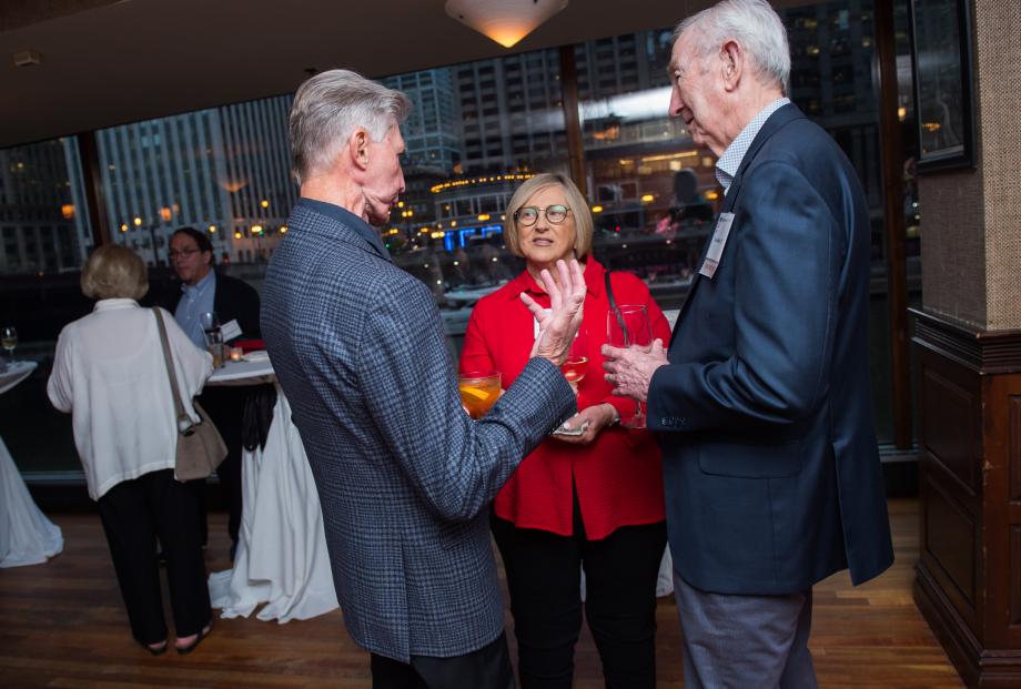 Three members of the Class of 1972 speak with each other