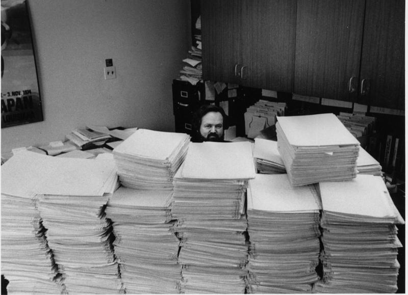 Richard Badger and a pile of applications, which grows every year.