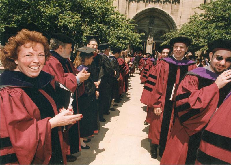 Then-Dean of Students Ellen Cosgrove, ’91, congratulating students at graduation in 2001.