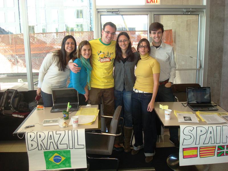 During the International Coffee Mess, LLMs set up tables and act as knowledge bases, acquainting the Chicago community to their home countries. International Coffee Mess
