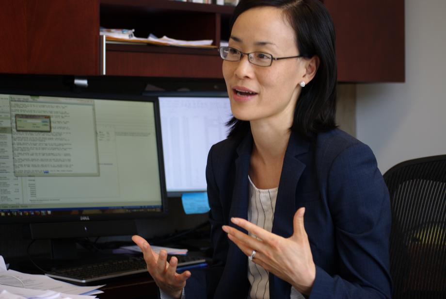 Jennifer Nou sits at her desk