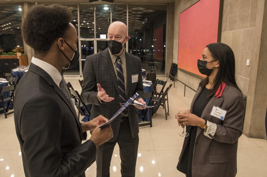 Professor Craig Futterman (center) speaks with James Jones, '22, and Caroline Ferguson, '22. 