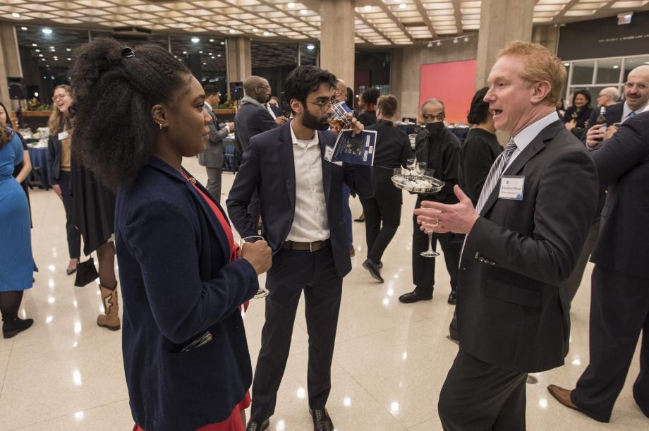 Among other faculty in attendance, Professor Jonathan Masur (right), chatted with Krystal Egbuchulam, '23, and Narayan Narasimhan, '23. 