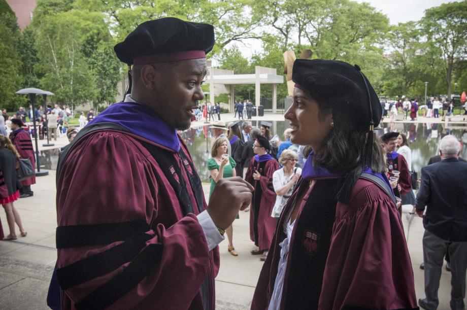 Two students talk at the Law School reception.