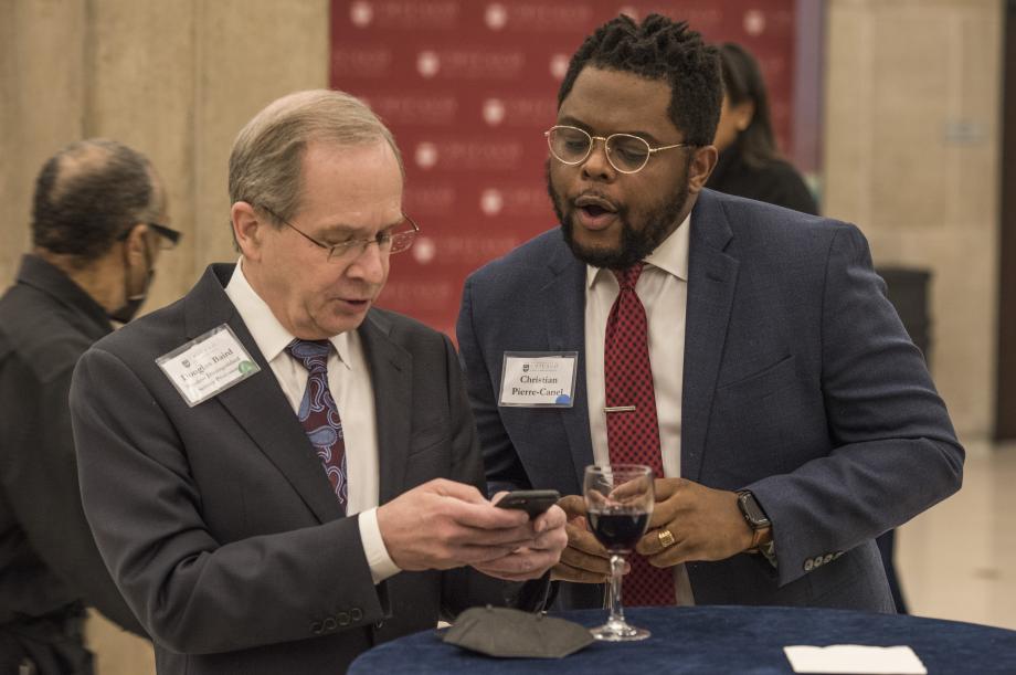 Professor Douglas Baird (left), shares something interesting with Christian Pierre-Canel, '24. 