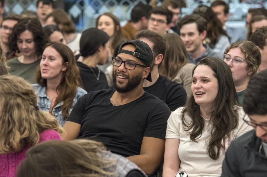 Smiling students listen during the live auction.